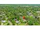 Overhead view showcasing the home nestled among lush trees in a quiet neighborhood at 1506 7Th Ave., Conway, SC 29526