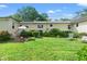 Spacious backyard with a lush lawn, patio furniture, and well-maintained landscaping at 1506 7Th Ave., Conway, SC 29526