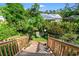Backyard space with deck area with wooden railing, a chair, and well maintained landscaping at 1506 7Th Ave., Conway, SC 29526