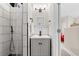 Modern bathroom with white subway tile, dark accents and a walk-in shower at 1506 7Th Ave., Conway, SC 29526