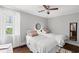 Well-lit bedroom with two twin beds, hardwood floors and comfortable furnishings at 1506 7Th Ave., Conway, SC 29526