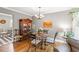Cozy dining room features hardwood floors, chandelier lighting, and vintage display cabinet at 1506 7Th Ave., Conway, SC 29526