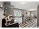 Bright kitchen with updated appliances, granite counters, and checkered flooring leading to dining area at 1506 7Th Ave., Conway, SC 29526