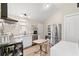 Bright kitchen features stainless steel appliances, wood floors and a vaulted ceiling at 1506 7Th Ave., Conway, SC 29526