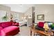Open living area with vaulted ceiling features a bed, desk and comfortable seating at 1506 7Th Ave., Conway, SC 29526