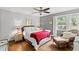 Relaxing main bedroom boasts hardwood floors and charming decor with plenty of sunlight at 1506 7Th Ave., Conway, SC 29526