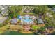 Aerial view of community pool with chairs, palm trees, lake and recreation center at 1524 Culbertson Ave., Myrtle Beach, SC 29577
