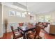 Elegant dining area featuring a wooden table with leather chairs and a view into the living room at 1524 Culbertson Ave., Myrtle Beach, SC 29577