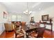 Open-concept dining area with a wooden table, leather chairs, and views of the living space at 1524 Culbertson Ave., Myrtle Beach, SC 29577