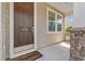 Close-up of the front door with stone accents, a 'Welcome' mat, and the house number at 1524 Culbertson Ave., Myrtle Beach, SC 29577