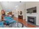 Open-concept living room with a fireplace, large TV, and view of the kitchen and dining area at 1524 Culbertson Ave., Myrtle Beach, SC 29577
