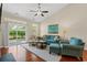 Comfortable living room featuring a blue sofa, patterned chairs, and a sliding glass door at 1524 Culbertson Ave., Myrtle Beach, SC 29577