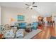 Spacious living room with a blue sofa, dining area, kitchen, and vaulted ceilings at 1524 Culbertson Ave., Myrtle Beach, SC 29577