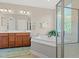Bright bathroom offers a luxurious tub, separate shower, and dual sink vanity at 1524 Culbertson Ave., Myrtle Beach, SC 29577