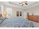 Spacious primary bedroom featuring carpet, a ceiling fan, and lots of natural light at 1524 Culbertson Ave., Myrtle Beach, SC 29577