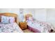 Comfortable bedroom featuring twin beds with stylish floral bedding and matching wicker headboards at 1533 Lanterns Rest Rd. # 304, Myrtle Beach, SC 29579