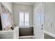 Inviting foyer featuring decorative accents, a stylish console table, natural light, and tiled flooring at 1533 Lanterns Rest Rd. # 304, Myrtle Beach, SC 29579
