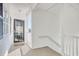 Hallway featuring an entrance door, stairwell, and tiled flooring at 1533 Lanterns Rest Rd. # 304, Myrtle Beach, SC 29579