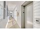 Hallway with elevator access and an outdoor walkway with windows and trim at 1533 Lanterns Rest Rd. # 304, Myrtle Beach, SC 29579