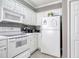 Well-equipped kitchen featuring white appliances, ample cabinet space, and clean countertops at 1533 Lanterns Rest Rd. # 304, Myrtle Beach, SC 29579