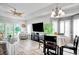 Bright and open living space with contemporary furnishings, a dining area, and a cozy screened-in porch at 1533 Lanterns Rest Rd. # 304, Myrtle Beach, SC 29579