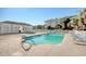 Community swimming pool with lounge chairs and a white picket fence at 1533 Lanterns Rest Rd. # 304, Myrtle Beach, SC 29579