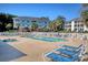 Community swimming pool with lounge chairs and nearby condos at 1533 Lanterns Rest Rd. # 304, Myrtle Beach, SC 29579