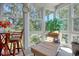 Bright sunroom filled with natural light with views of the outdoors at 1533 Lanterns Rest Rd. # 304, Myrtle Beach, SC 29579