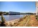 Condominiums overlooking a beautiful waterway with lush green landscape at 1533 Lanterns Rest Rd. # 304, Myrtle Beach, SC 29579