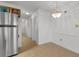 Dining area featuring tile flooring, a modern chandelier and stainless steel refrigerator at 1851 Colony Dr. # 4-F, Surfside Beach, SC 29575