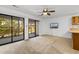 Bright living room with sliding glass doors to a patio and neutral carpet at 1851 Colony Dr. # 4-F, Surfside Beach, SC 29575