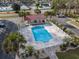 Aerial view of community pool with cabana, set among mature trees and well-maintained landscaping at 193 Charter Dr. # E-2, Longs, SC 29568