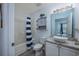 Bright bathroom featuring a vessel sink, granite countertop, and tub with shower at 193 Charter Dr. # E-2, Longs, SC 29568