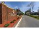 Inviting entrance to Colonial Charters Golf Community with brick signage and landscaped surroundings at 193 Charter Dr. # E-2, Longs, SC 29568