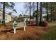 Welcoming sign for Colonial Gardens I & II set amidst mature trees and colorful landscaping at 193 Charter Dr. # E-2, Longs, SC 29568