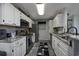 Updated kitchen with stainless steel appliances, granite countertops, and white cabinets at 193 Charter Dr. # E-2, Longs, SC 29568