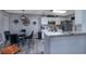 Cozy eat-in kitchen featuring granite countertops, stainless steel appliances, and pendant lighting at 193 Charter Dr. # E-2, Longs, SC 29568