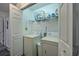 Well-lit laundry room featuring a side-by-side washer and dryer at 193 Charter Dr. # E-2, Longs, SC 29568