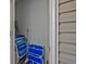 Image shows a closet with several folding beach chairs and cleaning supplies stored inside at 193 Charter Dr. # E-2, Longs, SC 29568