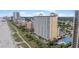 Aerial view of the condo complex showing the beach and adjacent buildings at 2000 N Ocean Blvd. # 502, Myrtle Beach, SC 29577