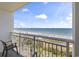 The private balcony features oceanfront views and comfortable patio furniture at 2000 N Ocean Blvd. # 502, Myrtle Beach, SC 29577