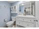 Bathroom with a light blue wall, a bright white vanity and fixtures at 2000 N Ocean Blvd. # 502, Myrtle Beach, SC 29577