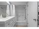 Clean bathroom with a tub, shower, and white vanity, perfect for relaxation at 2000 N Ocean Blvd. # 502, Myrtle Beach, SC 29577