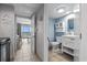 Adjacent to the kitchen, the well lit bathroom is designed with a beachy, bright, and airy theme at 2000 N Ocean Blvd. # 502, Myrtle Beach, SC 29577