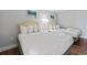 Comfortable bedroom featuring two beds with crisp white linens and beach-themed artwork at 2000 N Ocean Blvd. # 502, Myrtle Beach, SC 29577