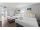 Bright bedroom with two queen beds, crisp white linens, and beach-themed artwork at 2000 N Ocean Blvd. # 502, Myrtle Beach, SC 29577