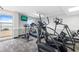 Gym features cardio machines, a wall-mounted TV, and large windows overlooking the ocean for an inspiring workout at 2000 N Ocean Blvd. # 502, Myrtle Beach, SC 29577