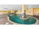 Spacious indoor pool area with stylish tile accents, columns, and plenty of natural light at 2000 N Ocean Blvd. # 502, Myrtle Beach, SC 29577