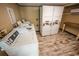 Well lit laundry room includes multiple machines, perfect for community living and conveniently located at 2310 N Ocean Blvd. # 308, Myrtle Beach, SC 29572
