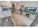 Living area features a modern TV, breakfast bar, and stylish decor elements at 2310 N Ocean Blvd. # 308, Myrtle Beach, SC 29572